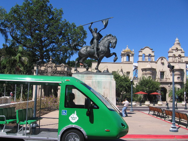 Balboa Park's free shuttle passes the El Cid statue on a sunny day.