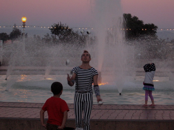 One last juggle by darkening fountain near Reuben H. Fleet Science Center.