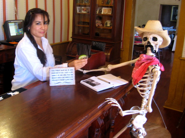 Bartender offers drink to skeleton cowboy at the Cosmopolitan Hotel's bar!