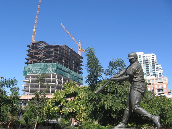 New Cisterra building rises behind Tony Gwynn statue at Petco Park in East Village.