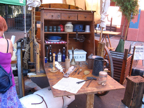Wood cabinet at rear of wagon is packed with wares typical in 1880's.