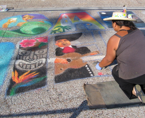 Chalk art created on the pier celebrates San Diego sights and tourism.