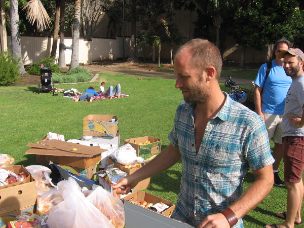 Rob Greenfield checks salvaged food to be assembled into activist art in Balboa Park.