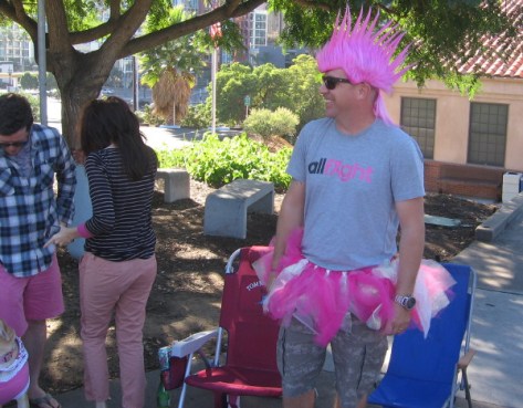 This cool bystander guy has a pink mohawk!