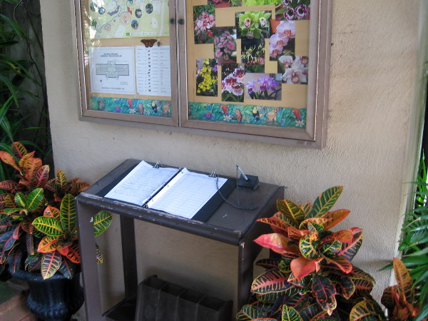 Information and guest book near entrance to historic Botanical Building.
