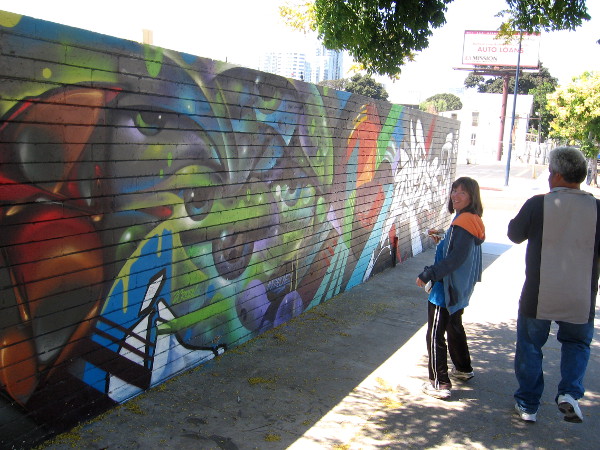 More artwork along F Street on the fence that borders SILO.