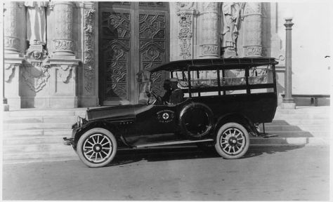 U.S. Navy ambulance parked near entrance of the California State Building, today the Museum of Man.