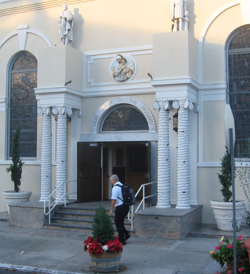 Walking past distinctive front of Our Lady of the Rosary church in Little Italy.