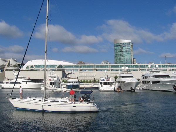 A bunch of beautiful yachts in a row behind the San Diego Convention Center.