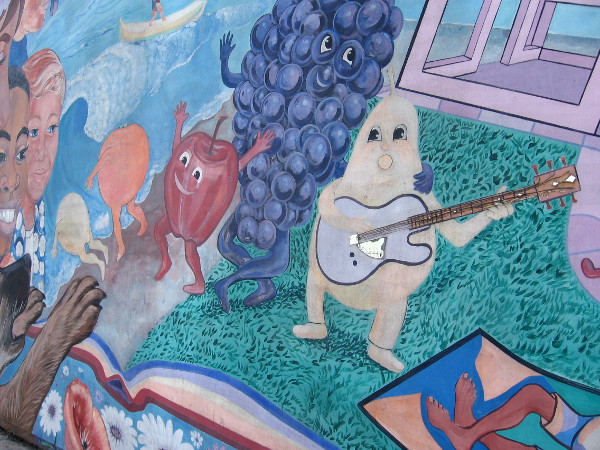 These animated fruit are goofing around in this fun Barrio Logan street mural.