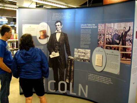 People at San Diego's new downtown public library check out a provocative historical exhibit.