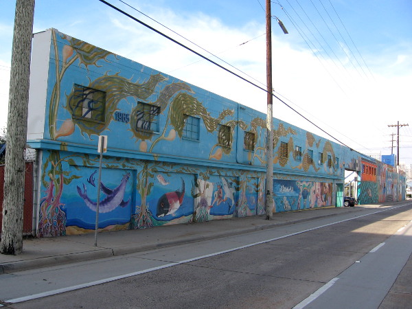 Long wall along Harbor Drive is the canvas for this very large street mural.
