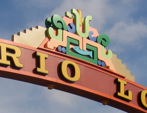 The cornice contains a variety of combined symbols that represent the community.