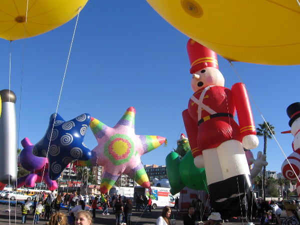A giant traditional Christmas nutcracker tips a bit in the sea breeze.
