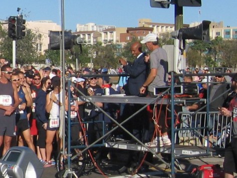 Elite long-distance runner Meb Keflezighi speaks to 5K race participants.
