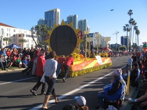 But the float's motor doesn't work! Guys have to push it down the parade route!