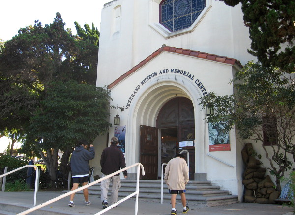 People head into the Veterans Museum and Memorial Center in Balboa Park.