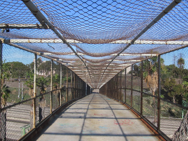This pedestrian bridge spans Interstate 5, connecting two unrelated parking lots.