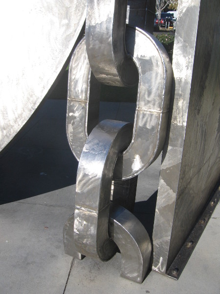 Huge chain links emerges from ground on the MLK Promenade in San Diego.