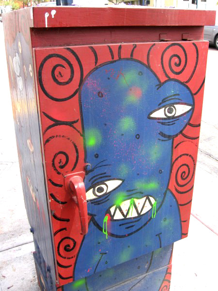 Crazy street art on a downtown utility box.