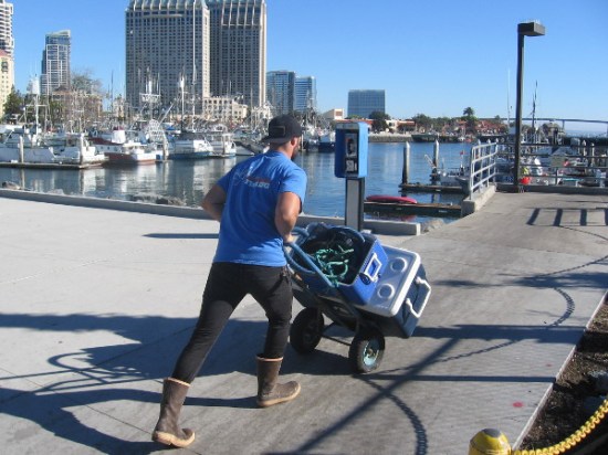 Fisherman heads to a boat in Tuna Harbor.