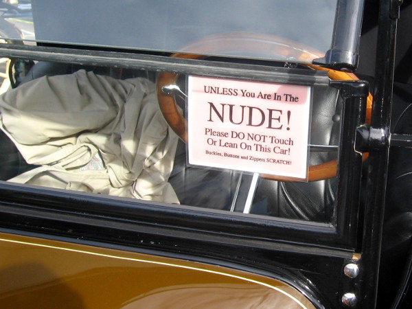 Don't touch this fancy car unless you are nude! (And showered, presumably.)