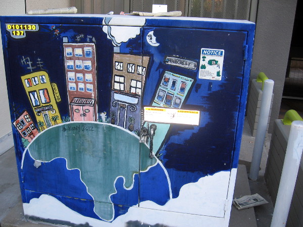 Cool utility box on Bankers Hill shows tall buildings on planet Earth.