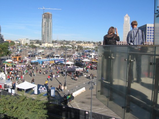 People gaze down at Monster Jam's Party in the Pits in the Petco stadium parking lot.