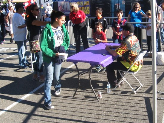 I guess this is a driver. He was signing autographs for lots of fans.