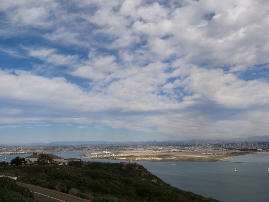 Naval Air Station North Island seems to glow beyond the Cabrillo National Monument Visitor Center building.
