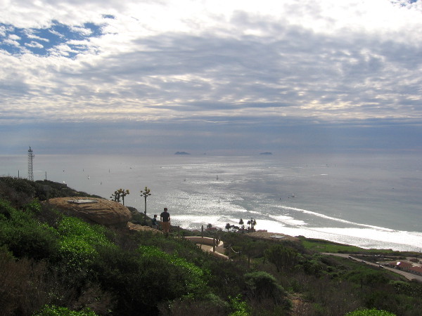 Looking southwest over two World War II bunkers toward the distant Coronado Islands, which are a part of Tijuana, Mexico. The new lighthouse is down by the water.