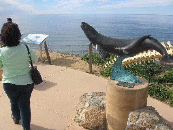 Sculpture of a gray whale and a cetacean's vertebrae along walkway that leads from the old lighthouse.