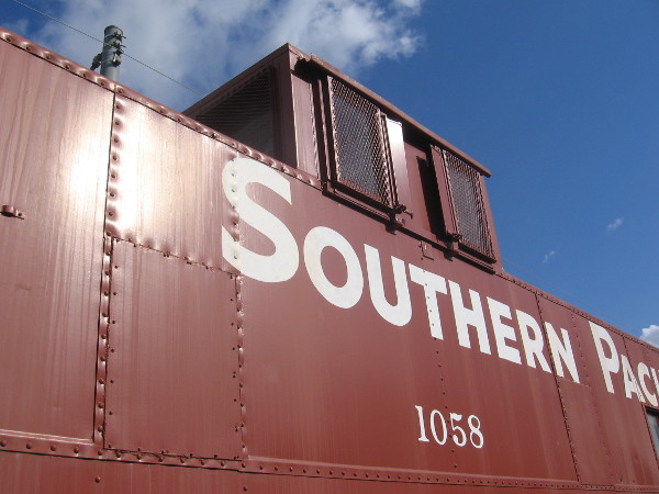 The conductor had high windows to see around the train during operation.