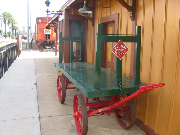 An old railway hand cart for hauling freight or luggage.