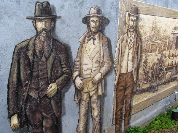 Several whiskered Western characters pose in a mural on Harney Street in Old Town.