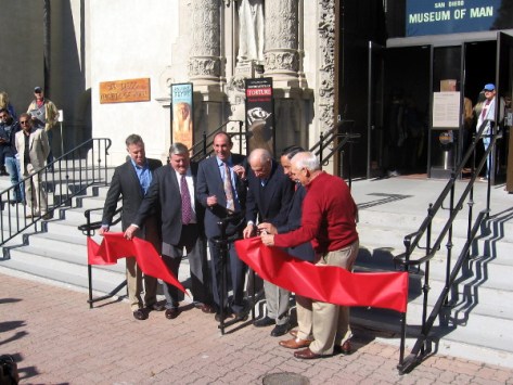 Dignitaries cut symbolic ribbon officially opening California Tower on New Year's Day.
