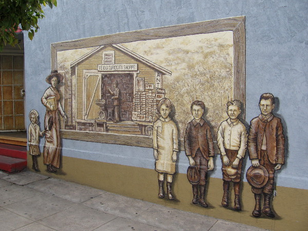 Old Town mural on building wall was painted in 2013 by artist Frank Mando.