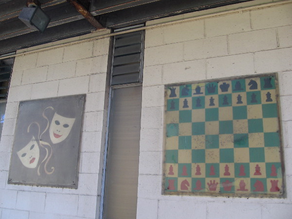 Chessboard and other old images on side facing Sixth Avenue are very faded.