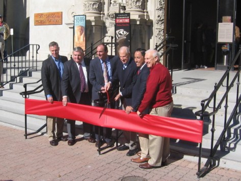 Local politicians, museum head and donor, poised ready to cut the big red ribbon!
