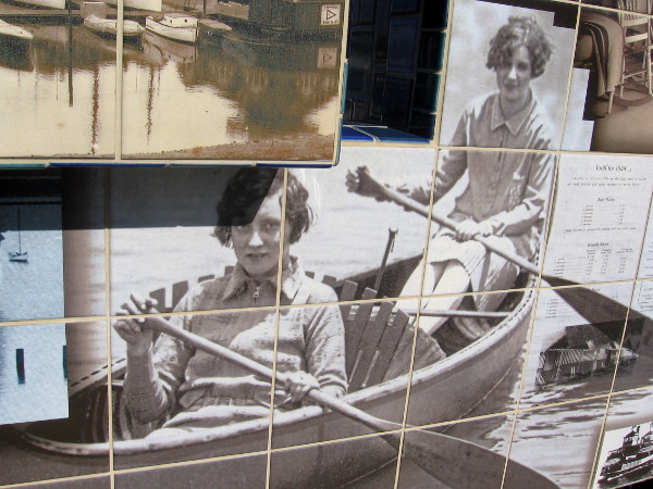 Two ladies row a pleasure boat.