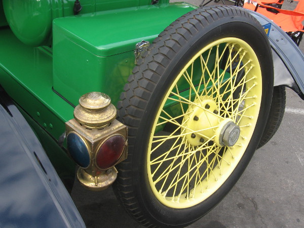 Red and green signal light near spare tire on back.