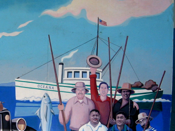 Part of the fun mural shows fishermen with a big catch.