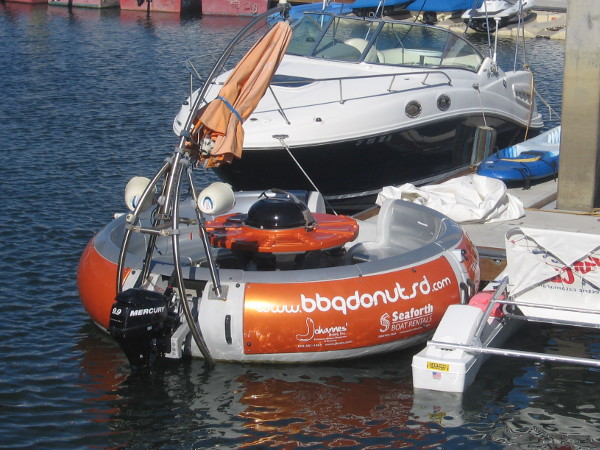 This crazy boat shaped like a donut features a huge central barbeque!