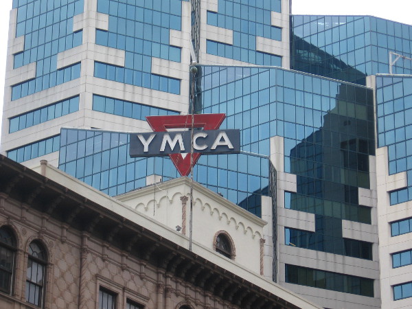 YMCA sign atop building near Emerald Plaza.