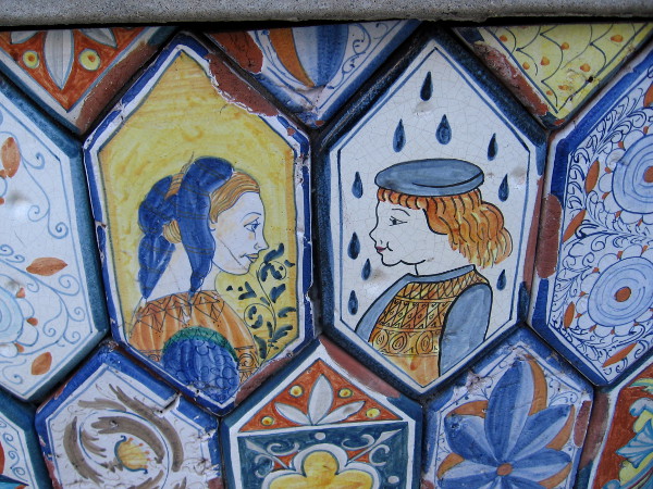 Colorful tiles around base of Piazza Villaggio fountain in Little Italy.