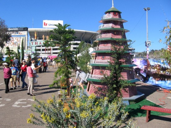 People check out colorful displays after entering the annual festival on a sunny weekend.