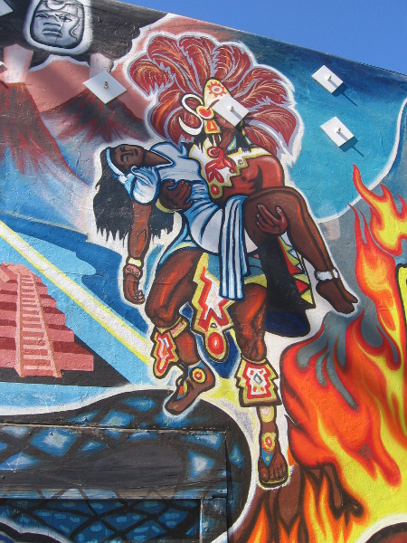 Aztec imagery is a colorful part of the artwork.