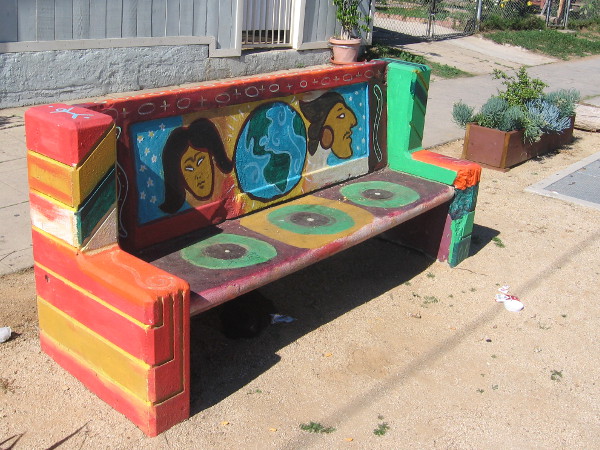 Brightly painted street bench on 25th Avenue in Sherman Heights.