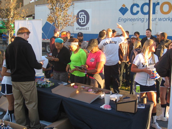 Diehard fans enjoy morning donuts and other goodies courtesy of the Padres.