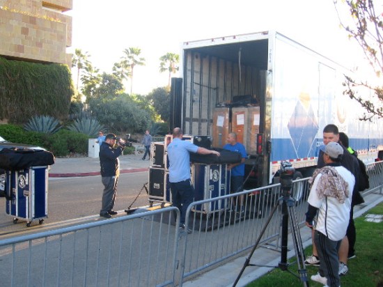 The final crates full of baseball equipment are loaded into one of the big trucks.